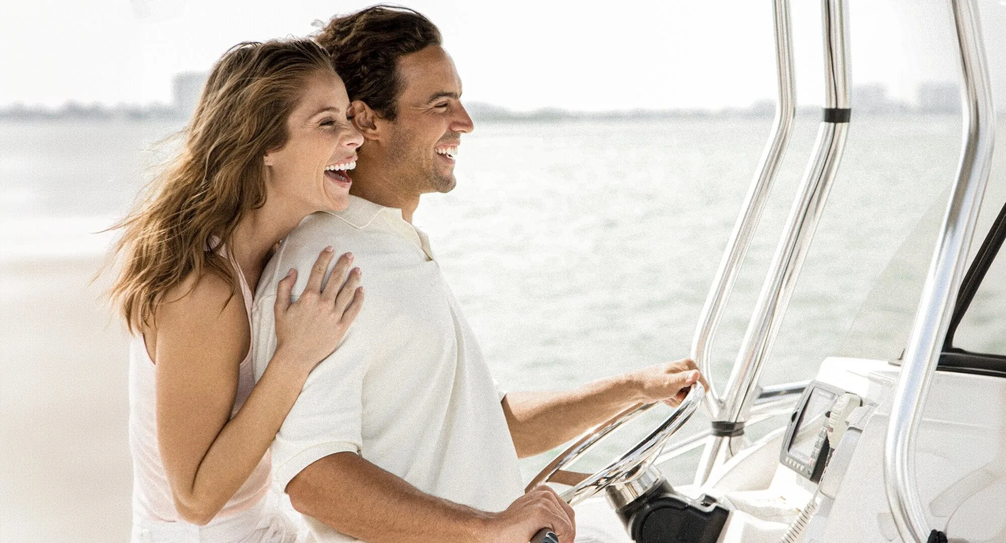 A couple enjoys at boat