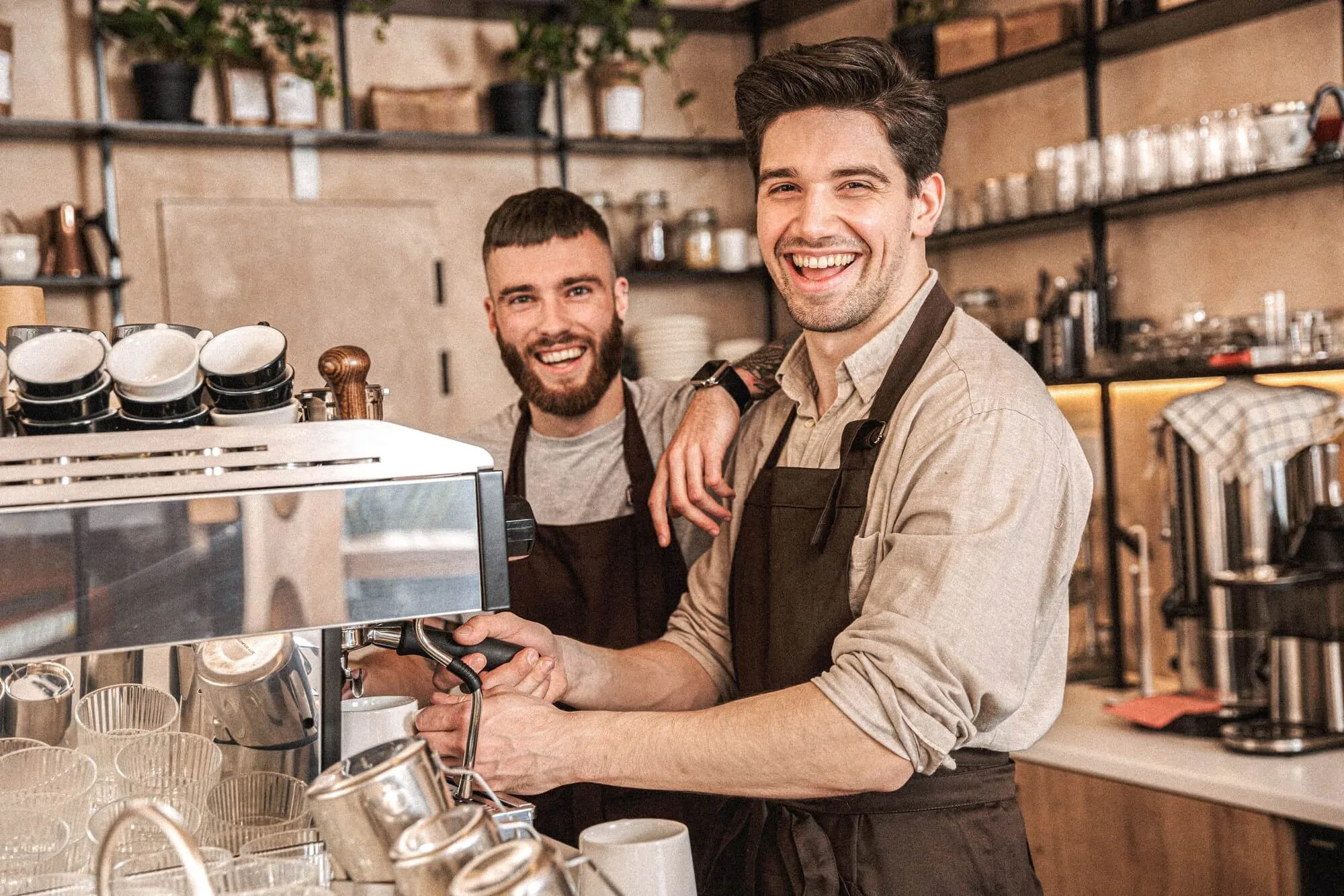 Two Boys making coffee and smiling