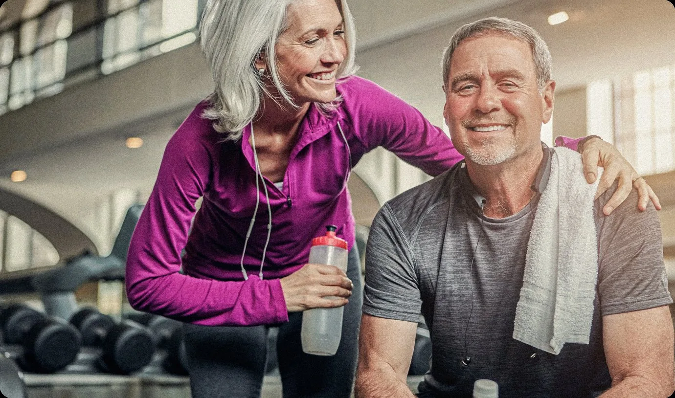 Active senior couple smiling after All-on-X treatment