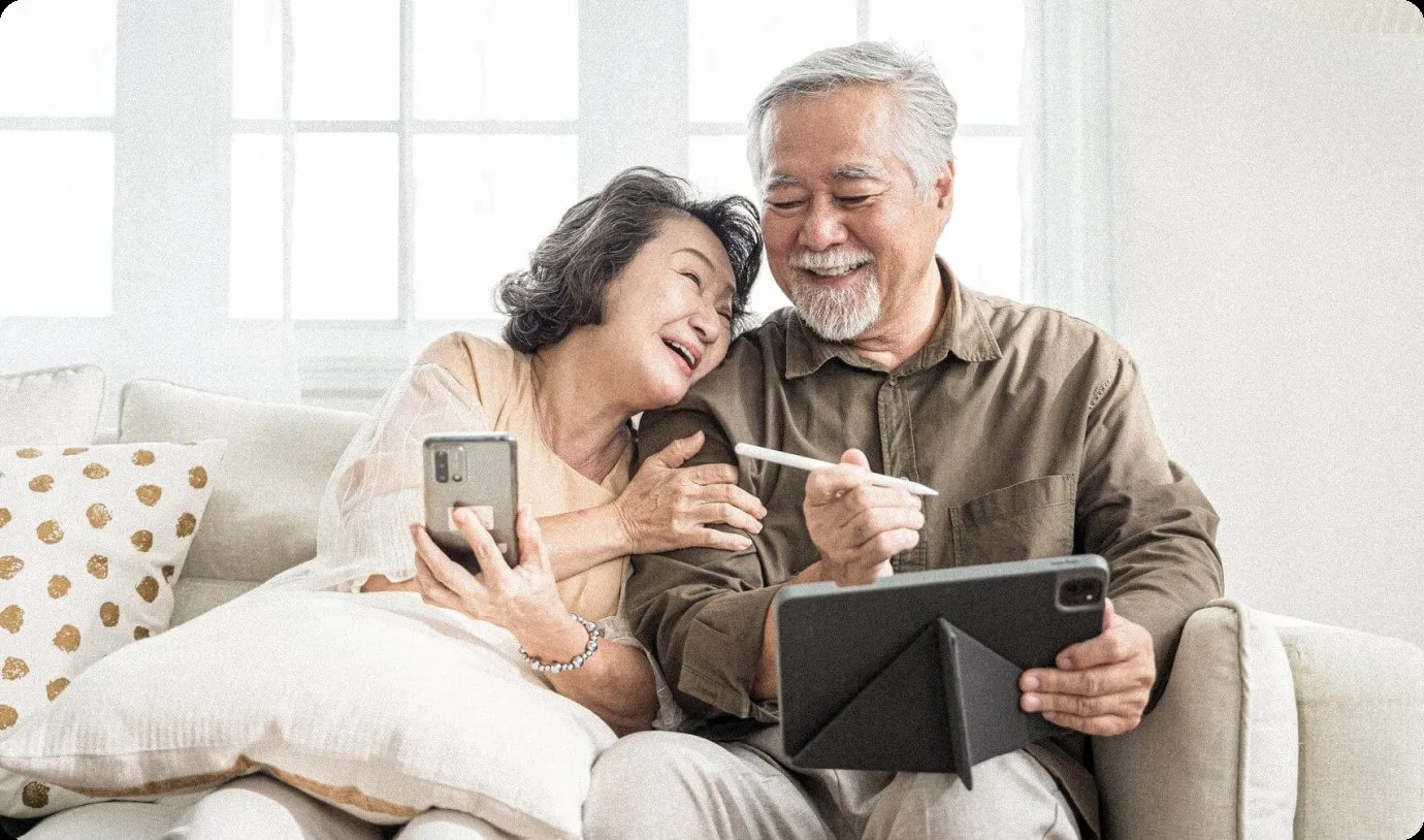 Senior couple smiling with custom dentures