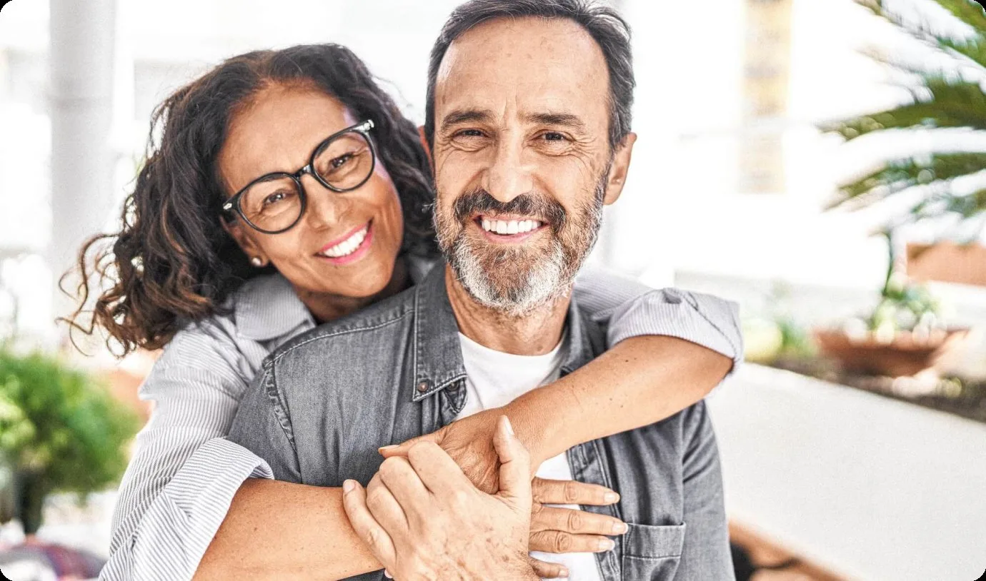 Smiling couple after dental extraction care