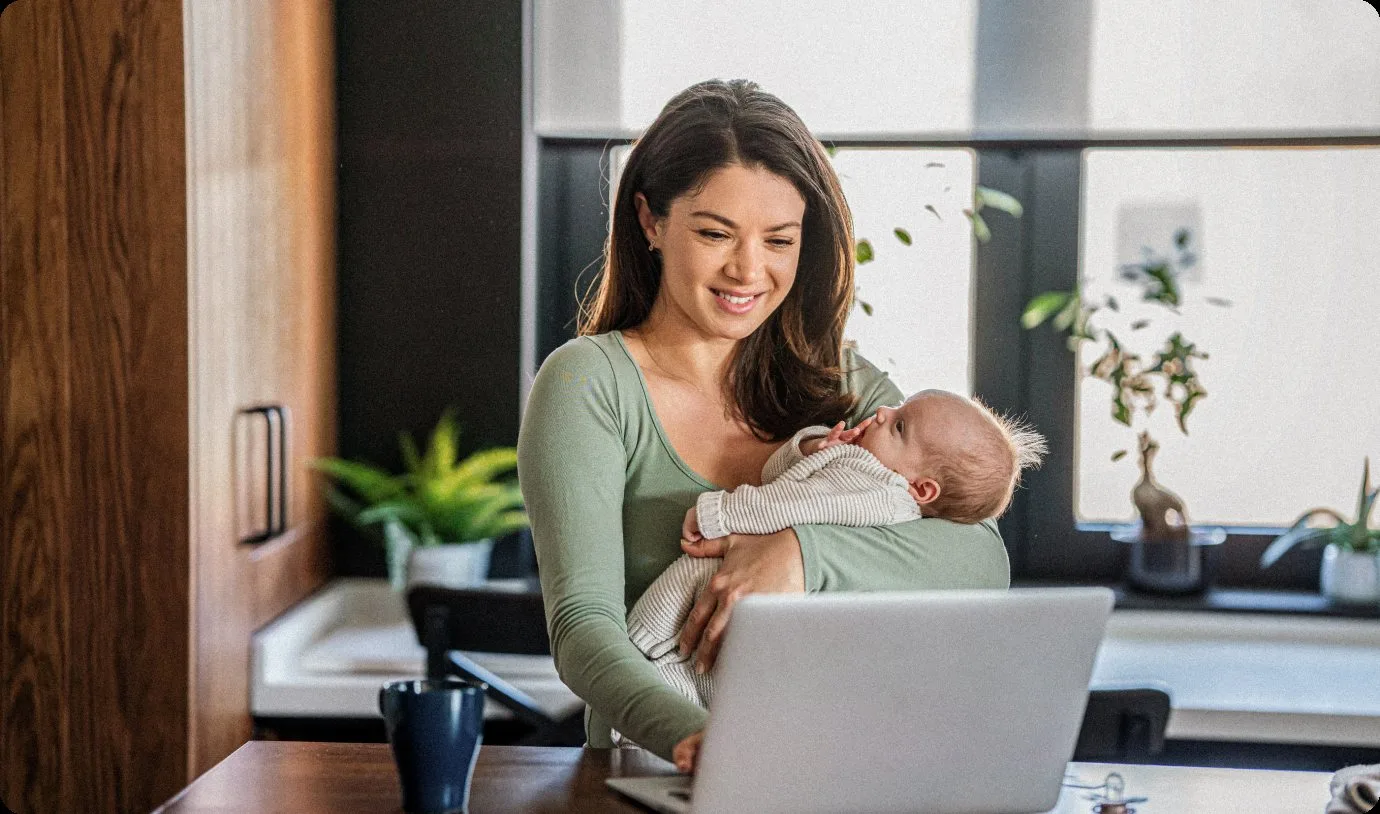 Mother with a baby joining a virtual dental consultation